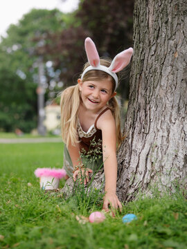 Girl Collecting Easter Eggs