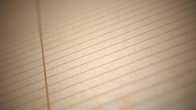 Vintage School Paper Close Up Background/ Animation of a close up vintage background of school paper with printed lines and depth of field blur