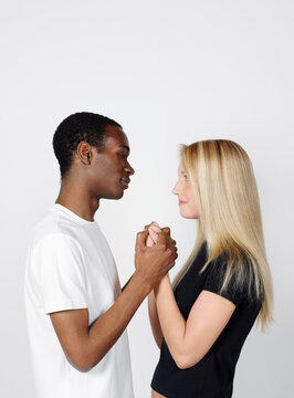 Couple Looking at Each Other and Holding Hands