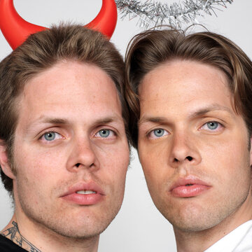 Portrait of Twin Brothers Dressed Like Devil and Angel