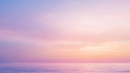 Fototapeta premium A calm, pastel-colored sky at sunrise, with gentle pinks and purples creating a peaceful atmosphere.