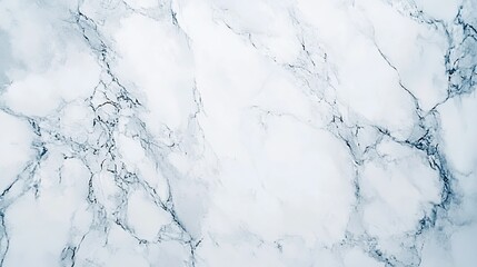 Fototapeta premium A high-angle view of a marble texture with subtle veining, offering a luxurious and timeless background.