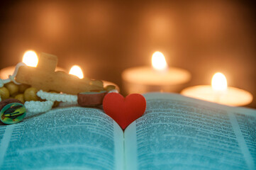 Heart space on top of a Bible with customizable space for text or religion message. Christianity...