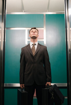 Businessman in Elevator