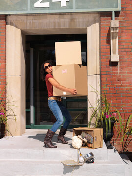 Woman Carrying Boxes