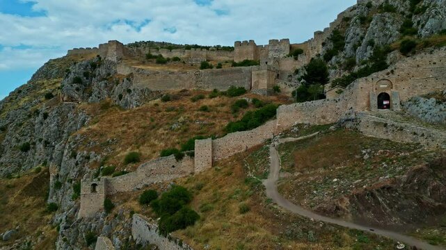 Fortress Akrokorinta castle, greek old Mediterranean rocky curvy terrain aerial drone establishing shot at daylight