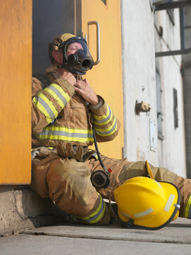 Firefighter in Doorway of Smoke-filled Building