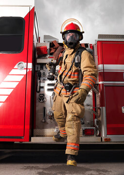 Fireman Pulling Fire Hose from Fire Truck