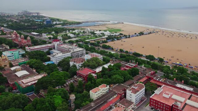 aerial view of marina beach and kamarajar promenade with government buildings, University of Madras, Ezhilagam, Napier Bridge, etc in chennai, tamil nadu, india. drone shot, 4k