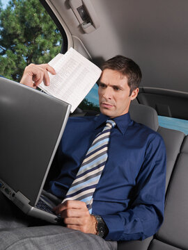 Businessman Working in Car
