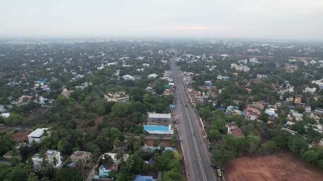 Tamil nadu homes, hospital, marriage halls, schools, colleges, and government offices are all visible in this early-morning aerial video of the state highway's main route.