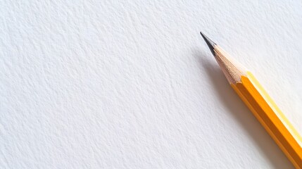 A single refined pencil mark on a clean white paper surface providing ample copy space for text or design  This simple elegant image conveys the concept of the start of a new idea or project