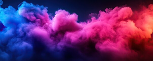 Fototapeta premium A vibrant abstract background featuring colorful smoke swirls in shades of blue, pink, and purple, creating a dreamy atmosphere.
