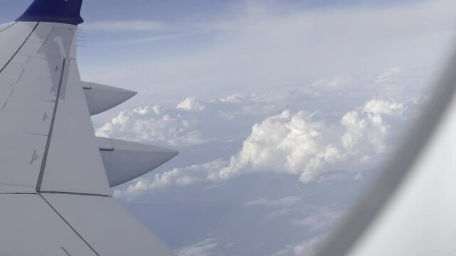 Experiencing turbulence on a commercial flight, looking out the window