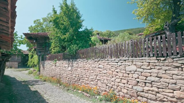 Rustic Stone garden wall on cobbled street Zheravna, Balkan Village
