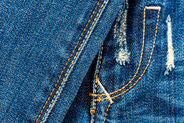 Jeans texture with seams close-up. Denim background. Seam
