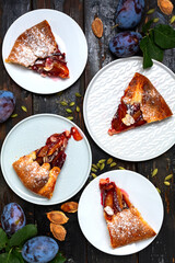 Slices of homemade plum cake with cardamom.