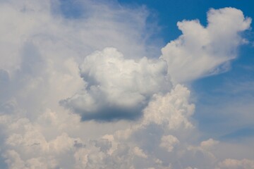 The white clouds in the bright blue sky.