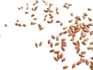 Tasty flax seeds on a white background.