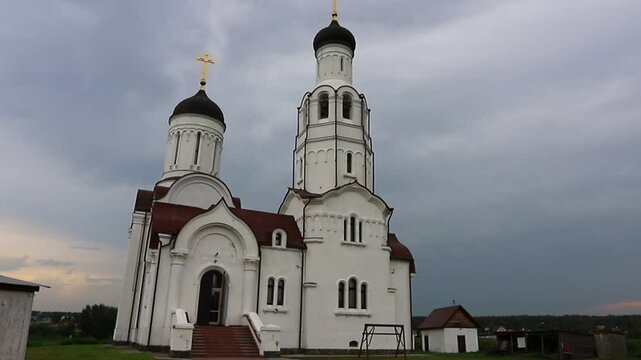 BURMISTROVO, ISKITIMSKY DISTRICT, NOVOSIBIRSK, RUSSIA -  27 JULY 2024:  Facade and exterior  Church of Vladimir the Equal-to-the-Apostles. Temple was built on the bank of the Miltyush River. 