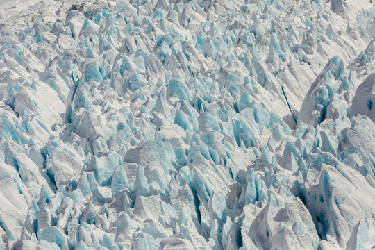 Aerial of jagged, blue ice formations of a glacier near Anchorage; Anchorage, Alaska, United States of America