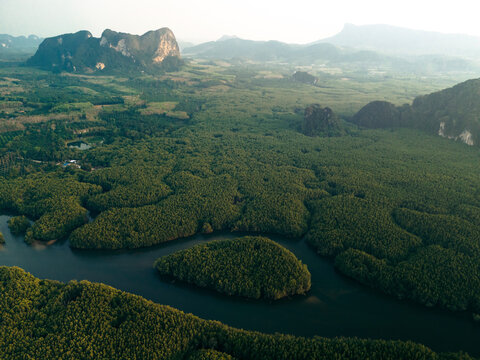 Waterways reaching inland and limestone cliffs with lush vegetation in Krabi, Thailand; Ao Nang, Krabi, Thailand