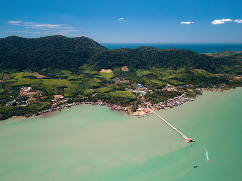 Lanta Old Town and Harbor pier in the turquoise Andaman sea and blue sky; Koh Lanta, Krabi, Thailand