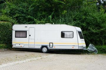 Caravan trailer is parked in the parking lot