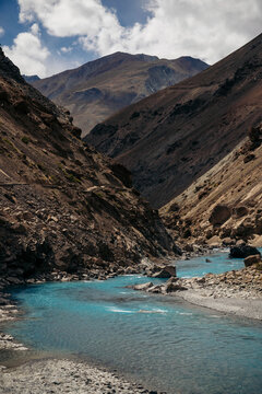 Aquamarine coloured river flowing through a Himalayan valley on route to Phuktal Gompa (Monastary) near Purne, Zanskar, Ladakh; Zanskar, Ladakh, India