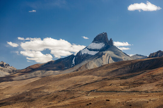 Rugged Himalayan mountains with snow and the valley on the road between Zangla and Wanla, Zanskar, Ladakh, India; Zanskar, Ladakh, India