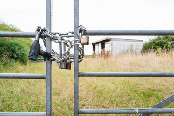 Shallow focus of a locked farm and paddock gate which has been subject to rural crime. Stout...