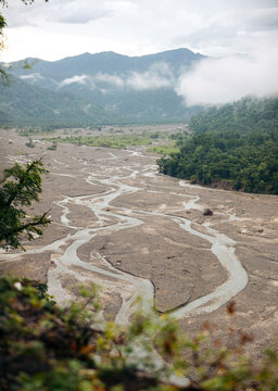 Braided river in a valley with lush vegetation; Rishikesh, Uttarakhand, India