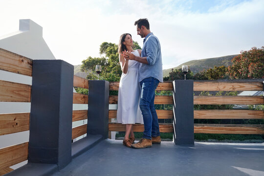 Couple embracing on terrace
