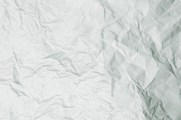 Crumpled white paper background.