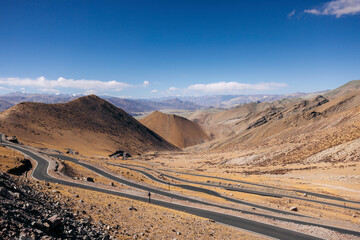 Photi La mountain pass winding across a mountainous terrain at Zanskar, Ladakh, India; Zanskar, Ladakh, India