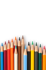 A vibrant collection of colored pencils arranged in a row, showcasing a variety of colors including red, blue, green, yellow, and orange against a white background.
