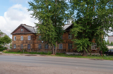 Old traditional two-storey wooden building in Kotlas, Arkhangelsk region, Russia