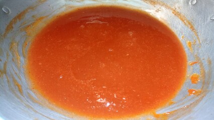 photo of very spicy chili sauce in a frying pan with a mixture of other spices