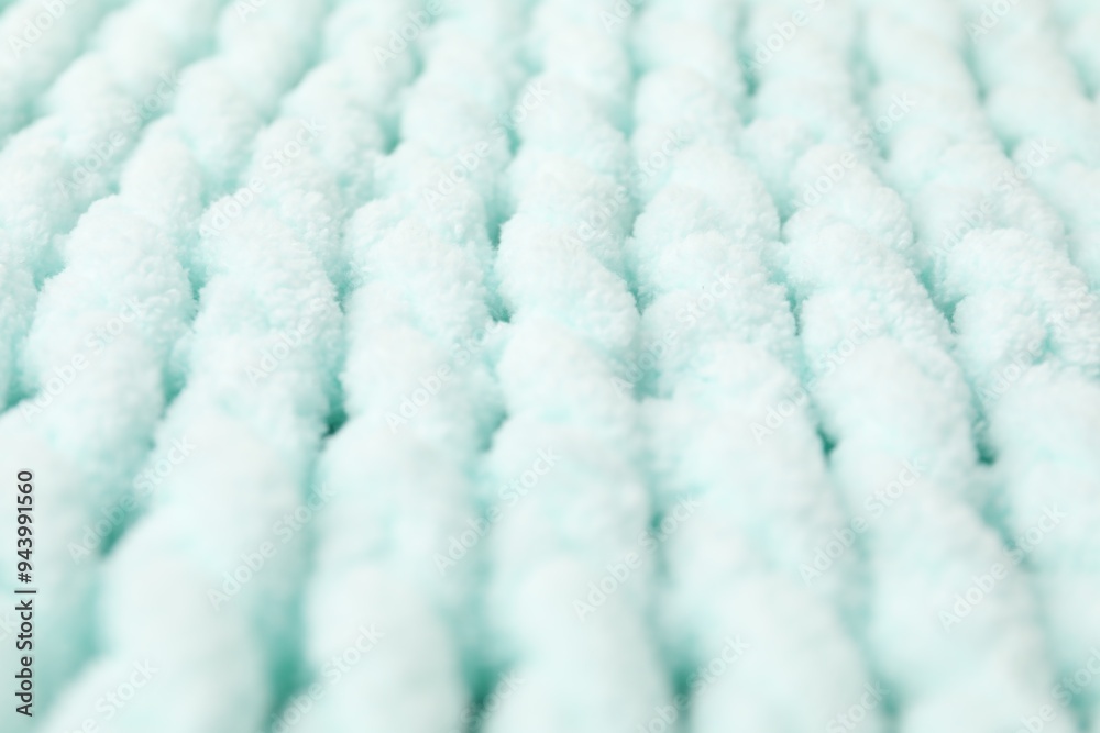 Poster Texture of light blue knitted fabric as background, closeup