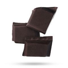 Pieces of sweet chocolate falling on white background