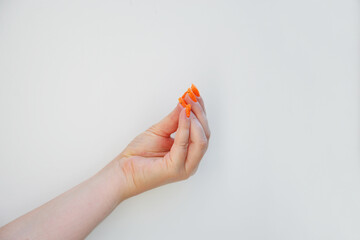 italian hand gesture woman sign of woman with orange manicure nails