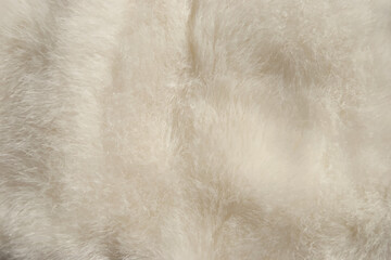 White fur texture background. White fur close up. Artificial white fur.