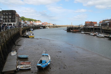 Whitby North Yorkshire UK 21st August 21 2024 Whitby a British seaside town  with boats moored in the harbour on a  hot summers
