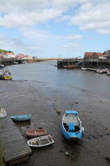 Whitby North Yorkshire UK 21st August 21 2024 Whitby a British seaside town  with boats moored in the harbour on a  hot summers