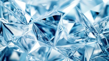 Abstract background composed of crystal facets in cool tones, creating a textured and reflective surface for a modern design.