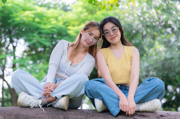Fototapeta na wymiar Couple of girl with girl,LGBT Pride month concept,Asian Handsome male make up and wear woman cloth,Gay Freedom Day,Portrait of Non-binary on white background
