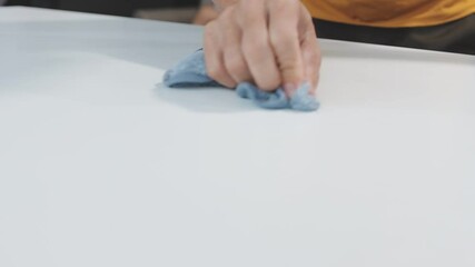 Cleanliness asian young woman working chore cleaning on table at home, hand wearing glove using rag rub remove dust with spray bottle. Household hygiene clean up, cleaner, equipment tool for cleaning