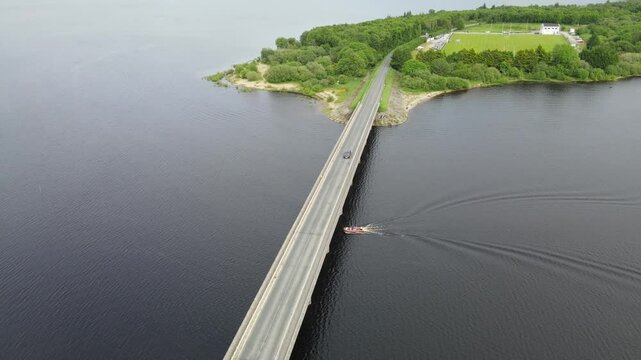 A boat moving under a bridge, car crossing. Blessington Lakes, Wicklow