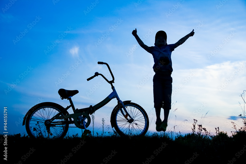 Canvas Prints a happy child and bike concept in park outdoors silhouette