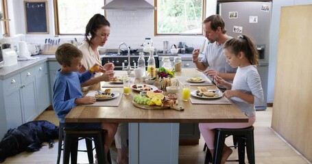 Food, breakfast and care with family in kitchen for health, love and eating together. Smile, relax and nutrition with parents and children at dining table in home for fruit wellness and bonding